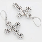 Sterling silver cross earrings with intricate cutout design, perfect for elegant occasions.